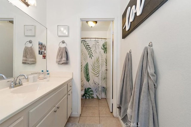 bathroom featuring toilet, tile patterned flooring, vanity, and a shower with curtain