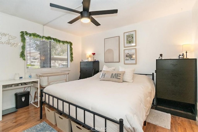 bedroom with light wood-style floors and ceiling fan