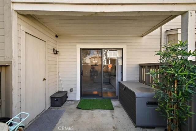 property entrance with a patio