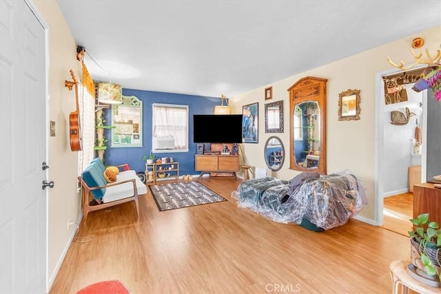 living room with wood finished floors and baseboards