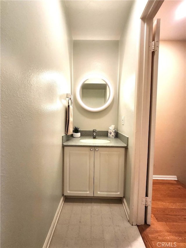 bathroom featuring vanity and baseboards