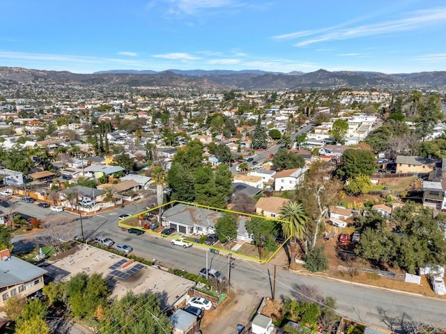 drone / aerial view with a residential view and a mountain view