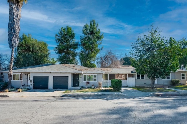 single story home with an attached garage and driveway