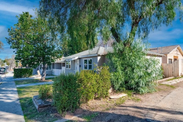 view of front of house featuring fence