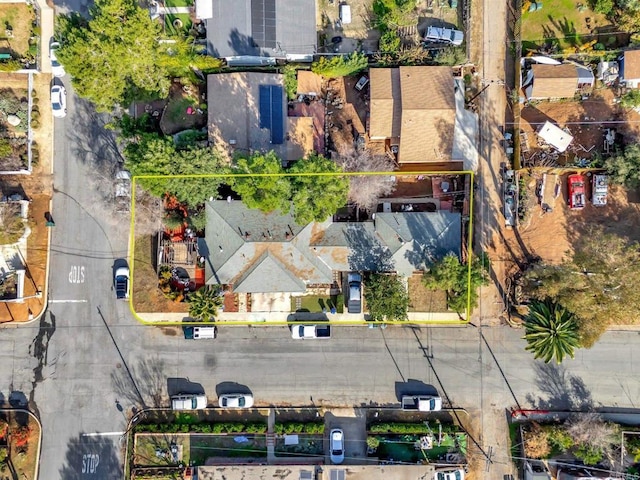 birds eye view of property with a residential view