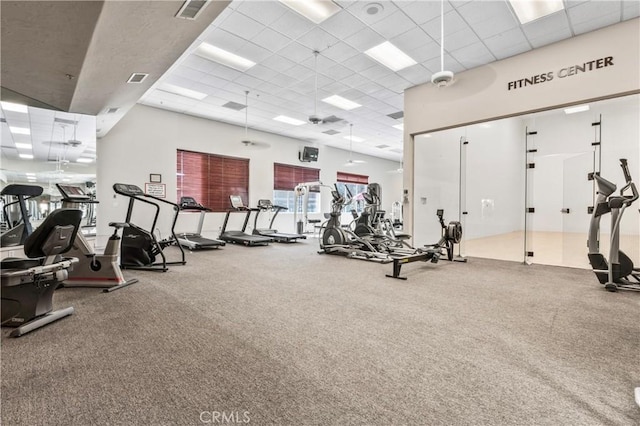 workout area featuring a paneled ceiling and visible vents