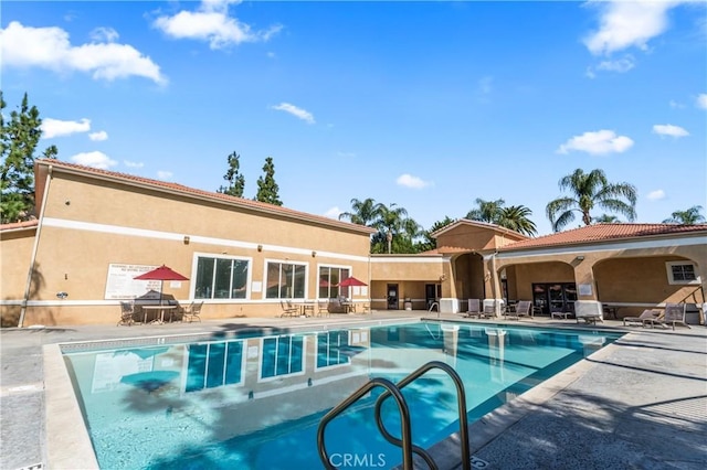 community pool with a patio