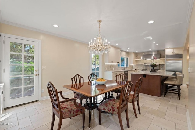 dining space featuring baseboards, ornamental molding, a notable chandelier, and recessed lighting