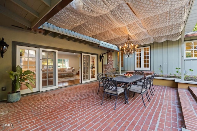 view of patio featuring french doors and outdoor dining area