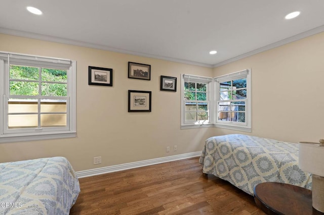 bedroom featuring ornamental molding, recessed lighting, baseboards, and wood finished floors