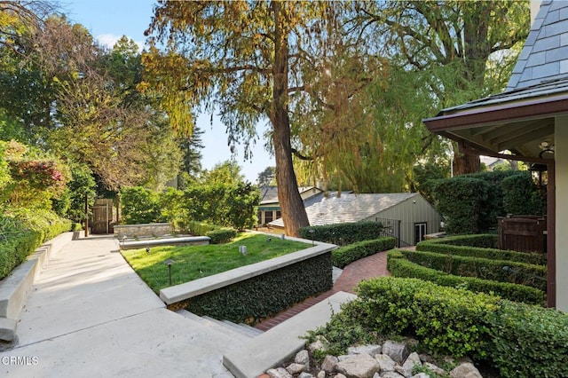 view of home's community with a lawn