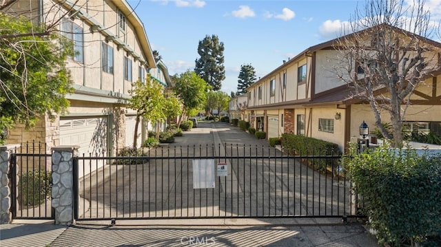 view of gate with fence