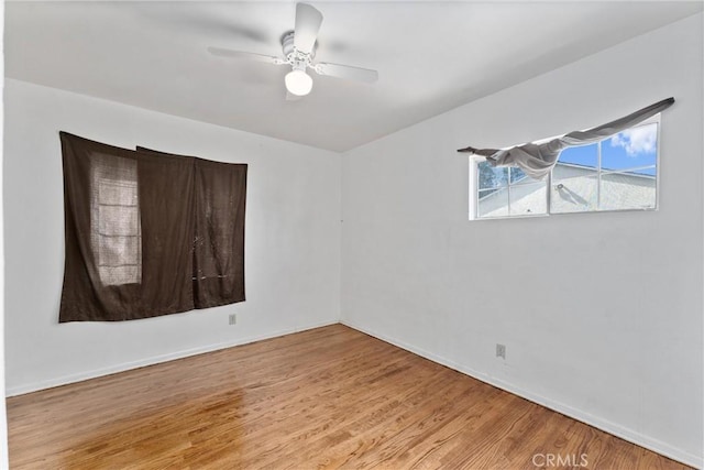 empty room featuring ceiling fan and wood finished floors