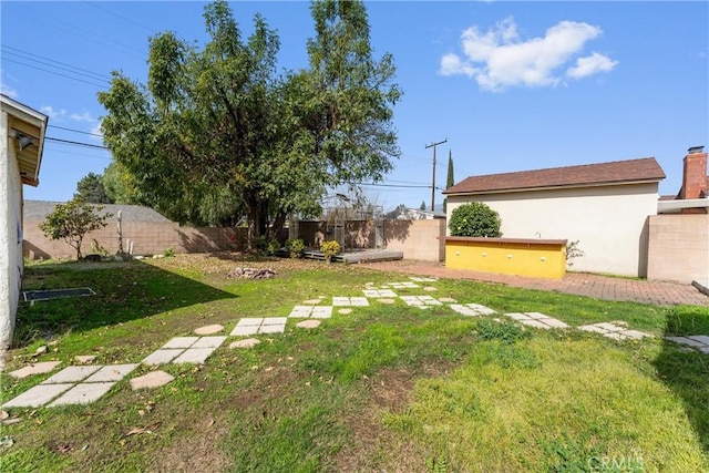 view of yard with a fenced backyard