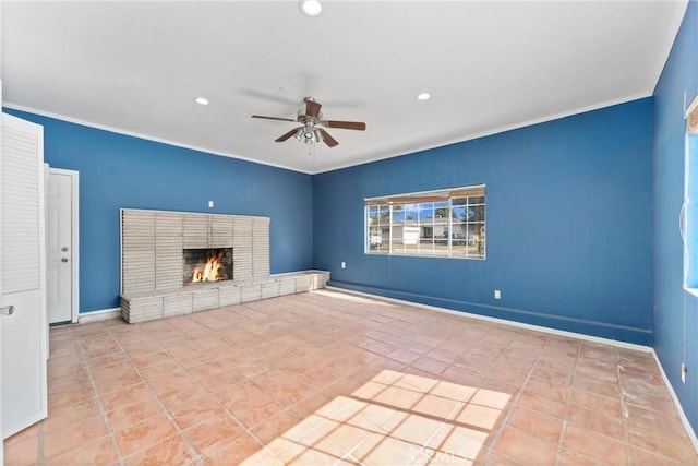 unfurnished living room featuring ceiling fan, recessed lighting, a fireplace, baseboards, and ornamental molding