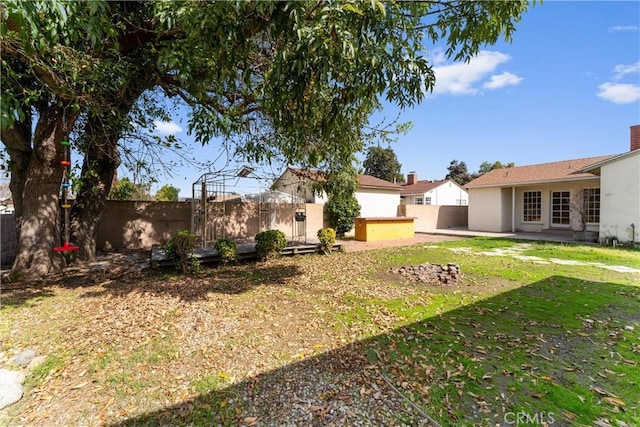 view of yard with a patio area and a fenced backyard