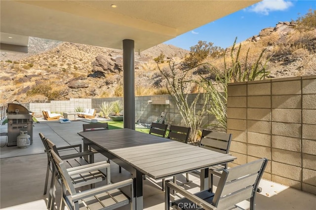 view of patio / terrace with outdoor dining area and a fenced backyard