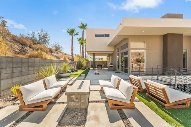 view of patio / terrace featuring a fenced backyard and an outdoor living space