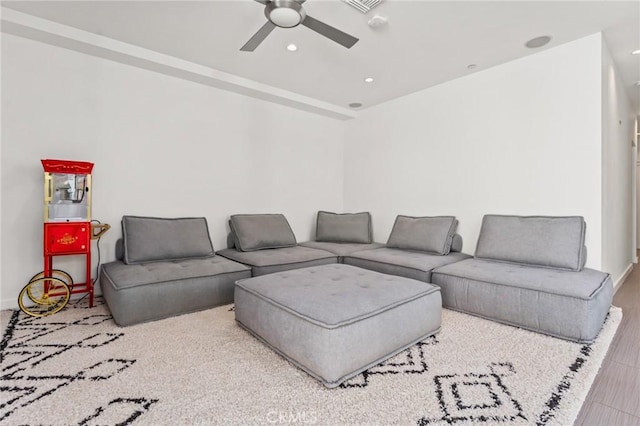 living room with ceiling fan and recessed lighting