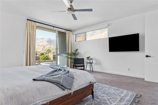 bedroom with a ceiling fan, carpet, and baseboards