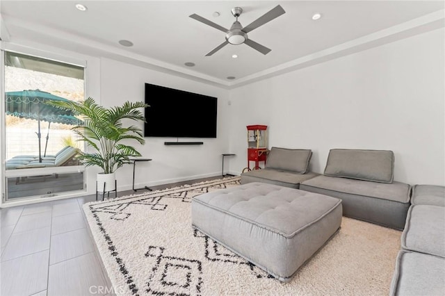 tiled living room with ceiling fan, baseboards, and recessed lighting