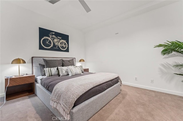 bedroom with light carpet, ceiling fan, and baseboards