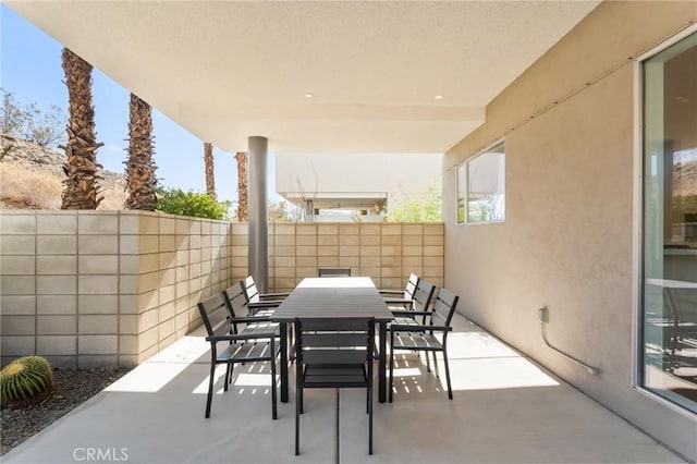 view of patio featuring a fenced backyard and outdoor dining area