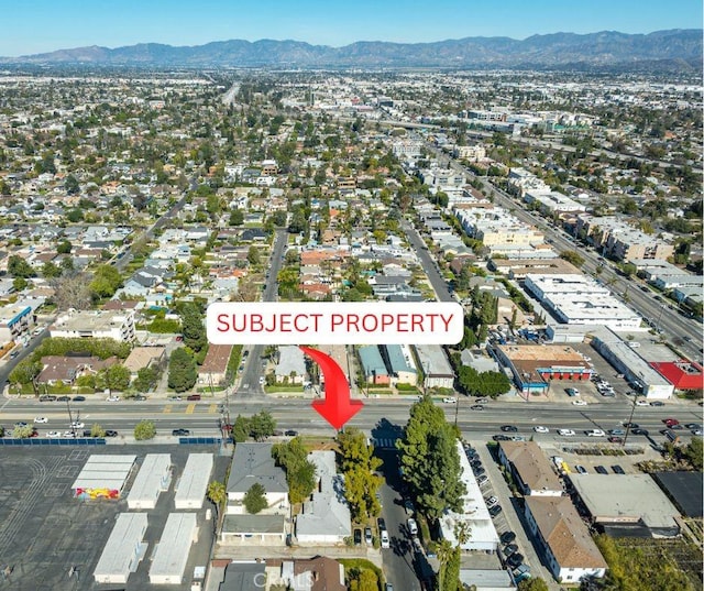 birds eye view of property featuring a residential view and a mountain view