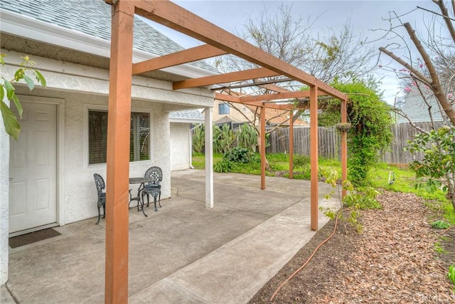 view of patio / terrace with fence and a pergola