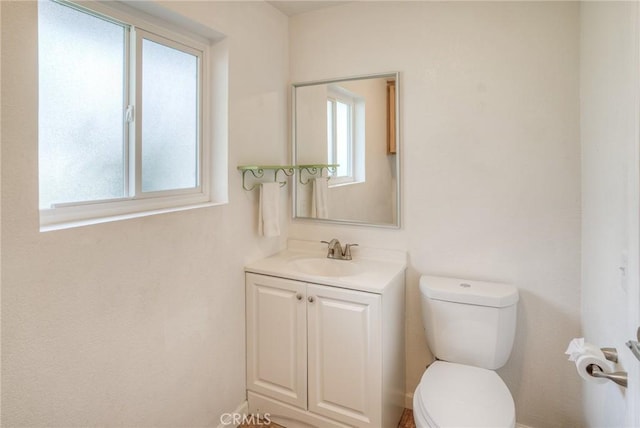 half bath with vanity and toilet