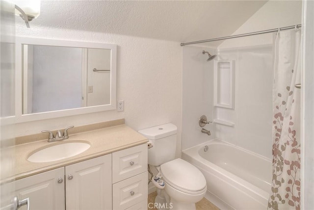 full bath with shower / bath combo, a textured wall, vanity, and toilet