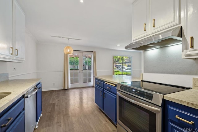 kitchen featuring blue cabinets, under cabinet range hood, white cabinetry, and appliances with stainless steel finishes