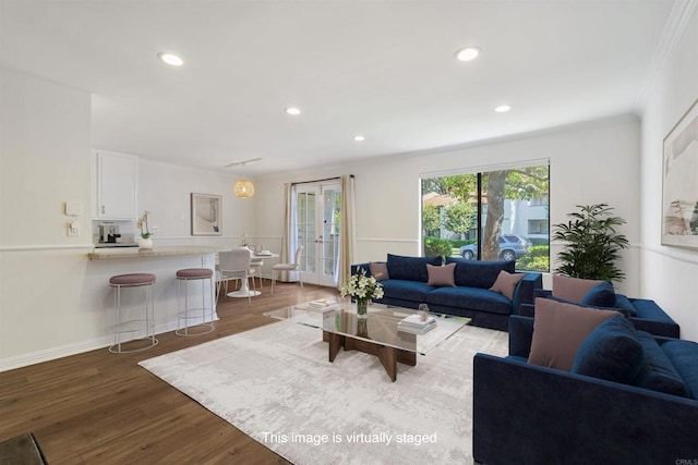 living room with baseboards, dark wood finished floors, crown molding, french doors, and recessed lighting