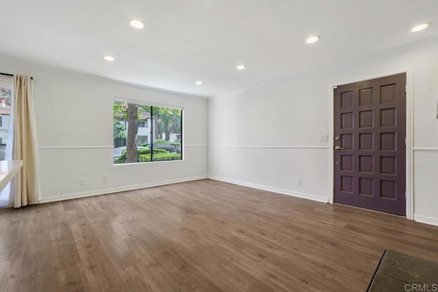 interior space featuring dark wood-style floors, recessed lighting, and baseboards