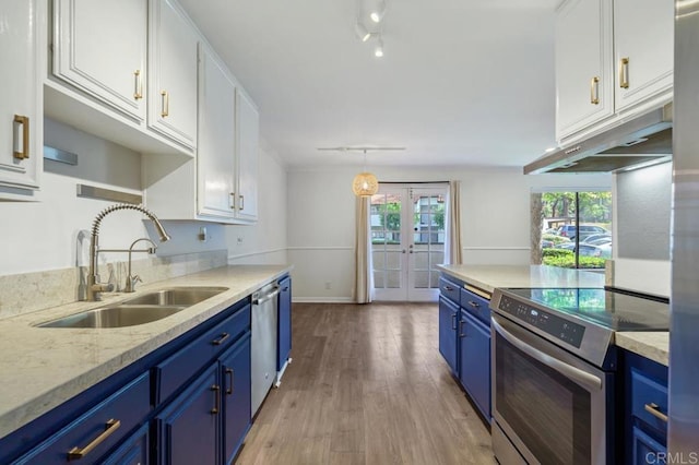 kitchen featuring french doors, blue cabinetry, appliances with stainless steel finishes, white cabinets, and a sink