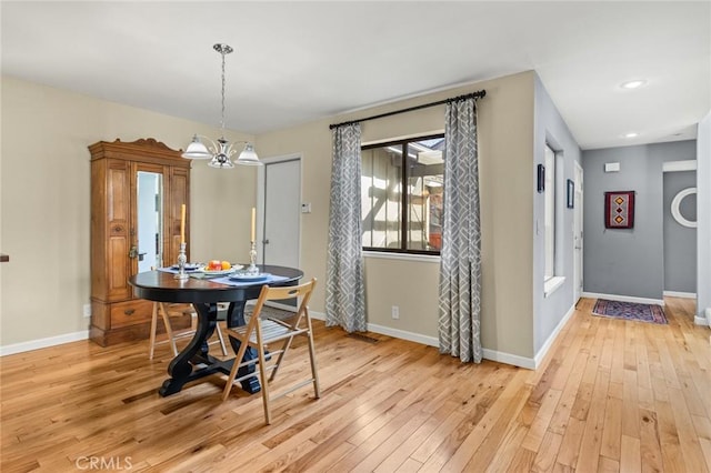 dining room with light wood finished floors, baseboards, a chandelier, and recessed lighting