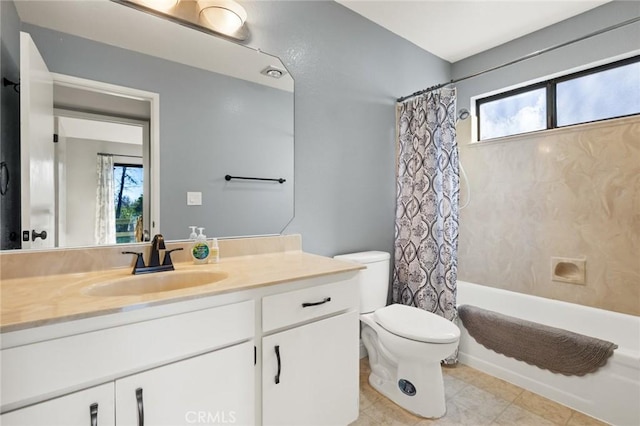 bathroom featuring a wealth of natural light, shower / tub combo, vanity, and toilet