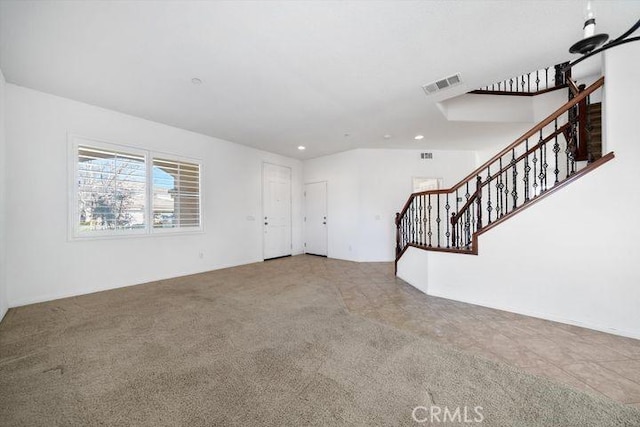 unfurnished living room with stairs, carpet floors, visible vents, and recessed lighting