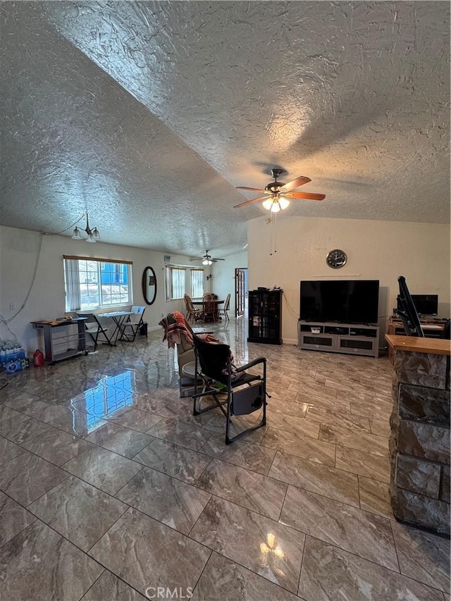 7687 Chase Ave, Hesperia, CA 92345 - living room with a ceiling fan, a textured ceiling, and marble finish floor