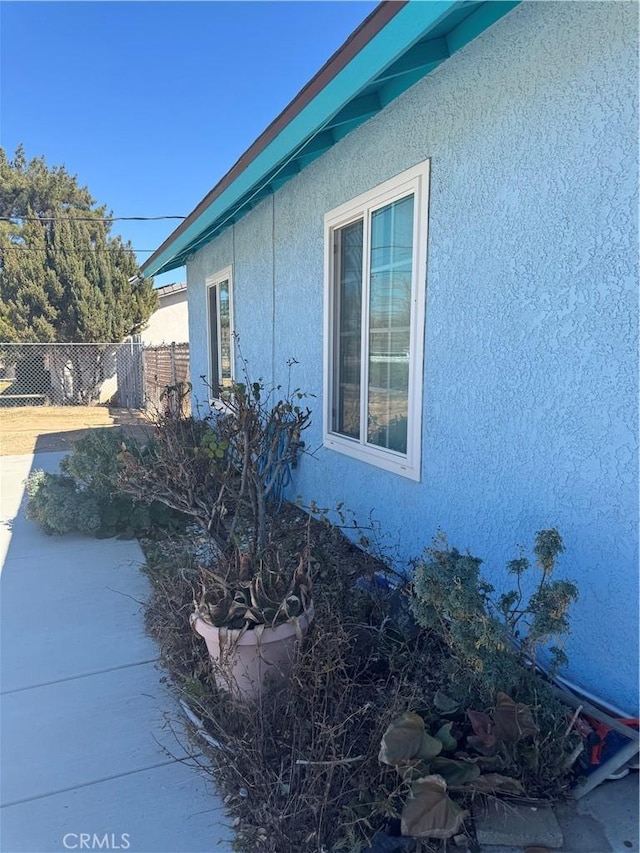 7687 Chase Ave, Hesperia, CA 92345 - view of side of property featuring fence and stucco siding