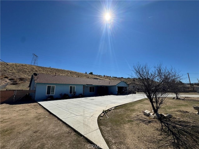 view of front of property featuring fence