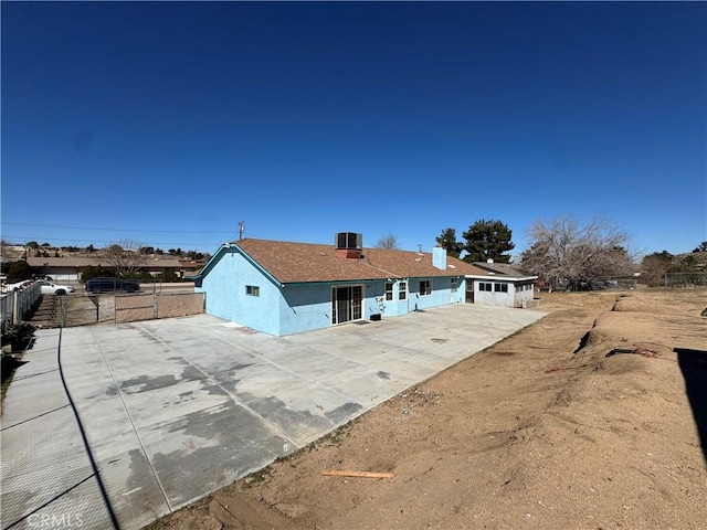 7687 Chase Ave, Hesperia, CA 92345 - exterior space with concrete driveway, a patio, stucco siding, fence, and central AC