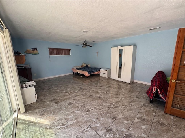 7687 Chase Ave, Hesperia, CA 92345 - unfurnished bedroom featuring a textured ceiling, visible vents, and baseboards
