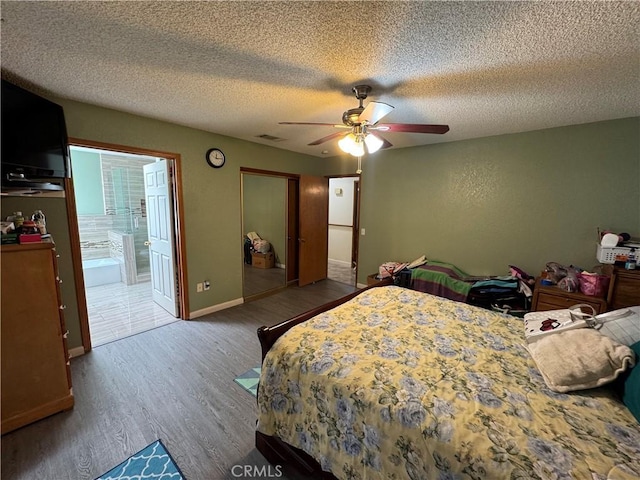 7687 Chase Ave, Hesperia, CA 92345 - bedroom with wood finished floors, a closet, ensuite bathroom, a ceiling fan, and a textured ceiling