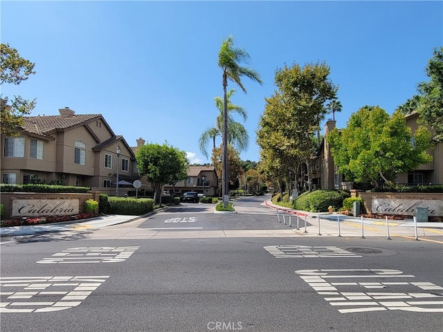 view of road with curbs and a residential view