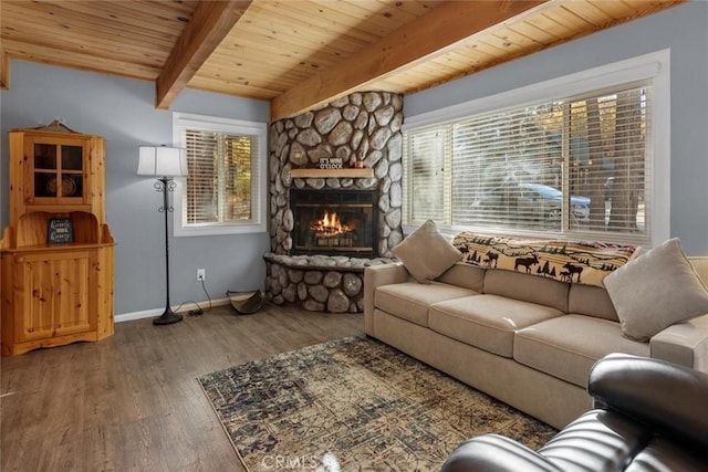 living area with baseboards, dark wood finished floors, wood ceiling, a fireplace, and beam ceiling