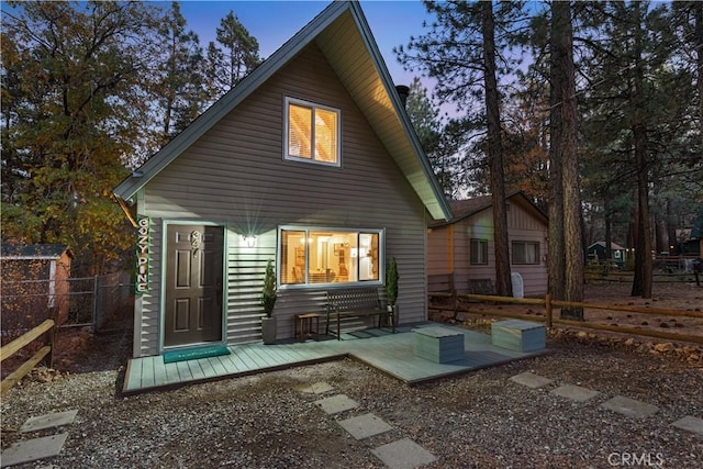 back of house featuring a patio area and fence