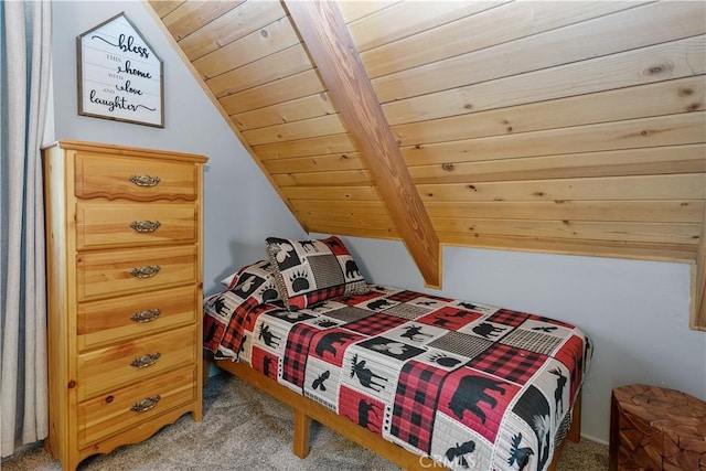 bedroom with vaulted ceiling with beams, carpet flooring, and wood ceiling