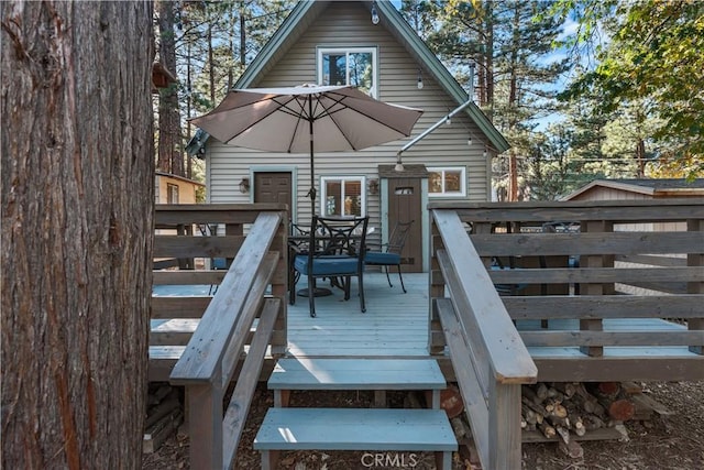 deck with outdoor dining space