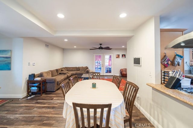 dining space featuring dark wood-style floors, baseboards, and recessed lighting